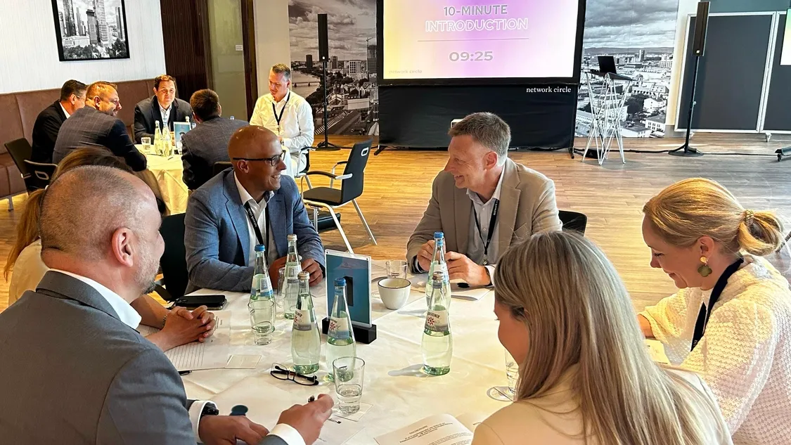 Executives Engaged in Strategic Discussion at Think-Tank Round
